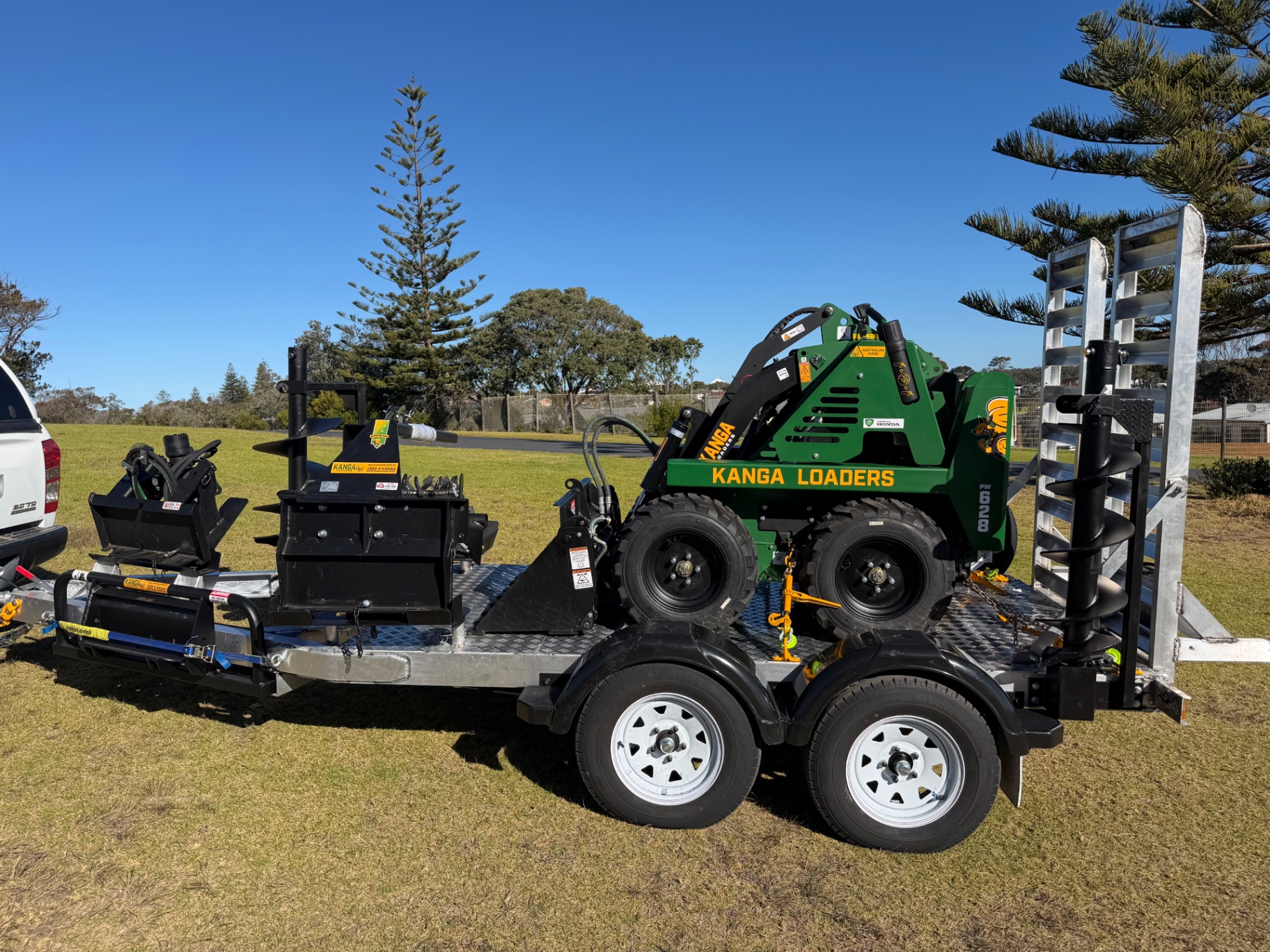 Kanga mini loader and Kubota excavator on plant trailers, equipment hire Bermagui